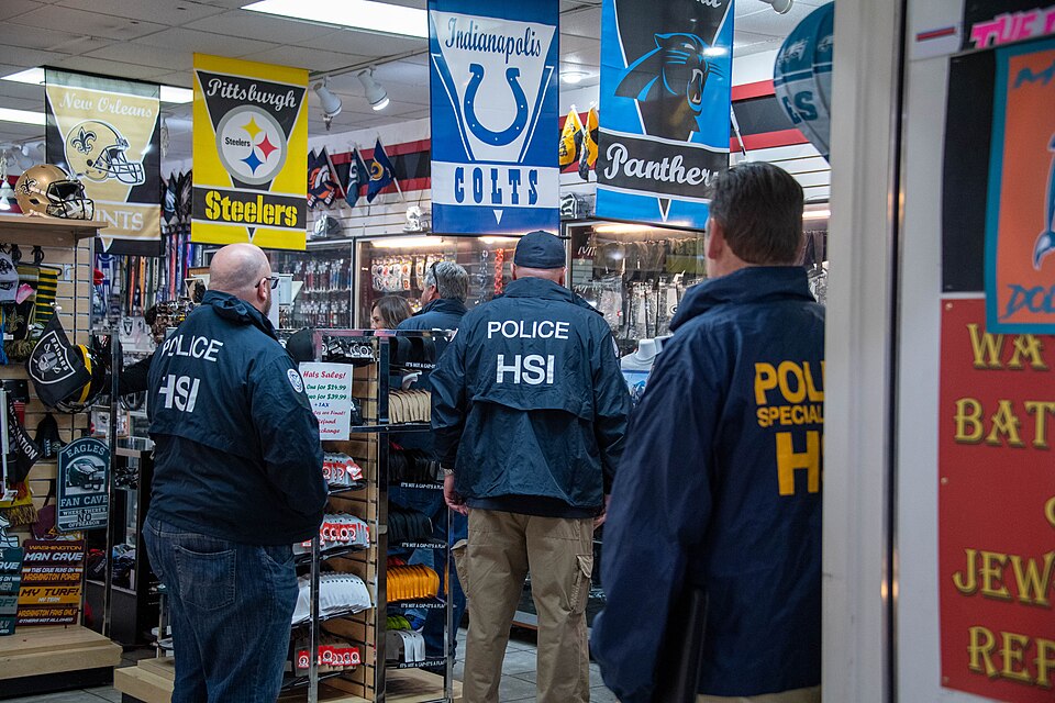HSI special agents conduct Intellectual Property Rights (IPR) enforcement activities in a mall in Ar