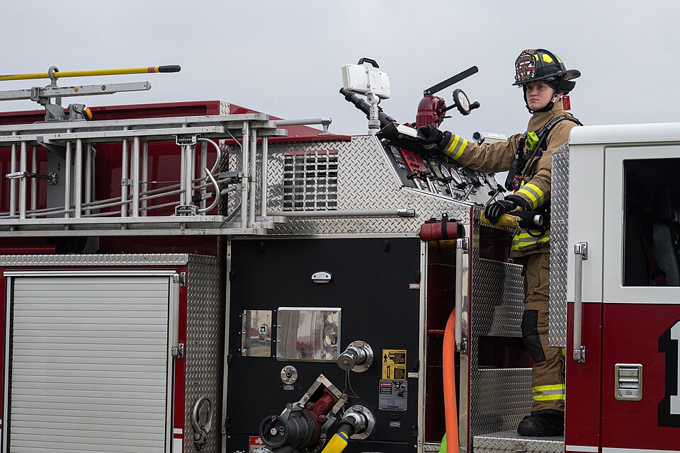 A U.S. Air Force firefighter assigned to the 100th Civil Engineer Squadron supervises the scene of a