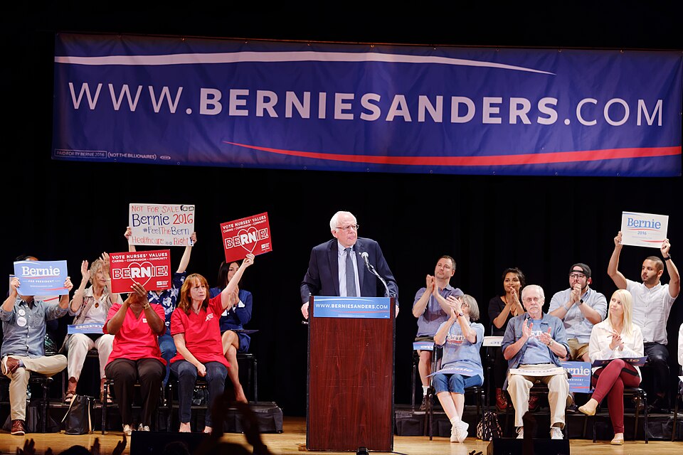 Outside of the Town Hall theater on West 43rd Street in Manhattan, a crowd of smiling and optimistic people Friday overflowed into the one-way street. Delivery trucks and yellow taxi cabs creeped by, their engines engaged in a shouting match with Bennet Weiss, a man who bore a fleeting resemblance t