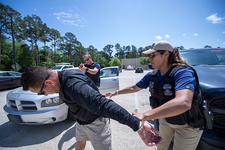 ICE Enforcement and Removal Operations (ERO) deportation officers conduct the simulated arrest of a 