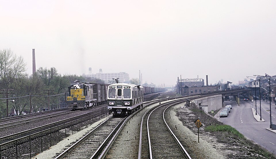 Before October 28, 1962 the Lake St. "L" ran at street level next to the C&amp;NW's elevated embankm