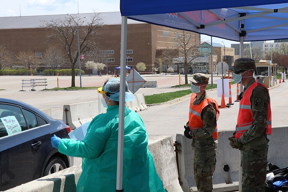 Iowa National Guard Soldiers of the 186th Military Police Company operate a traffic control point wi