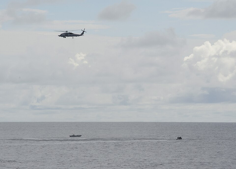 The Oliver Hazard Perry-class guided-missile frigate USS Vandegrift (FFG 48) and a U.S. Coast Guard 