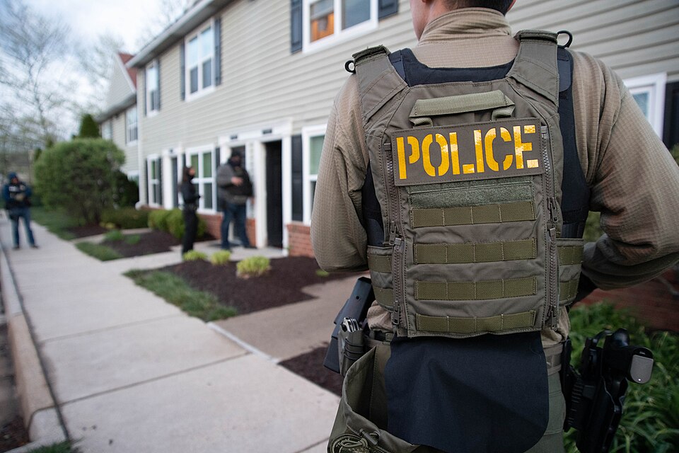 ICE deportation officers advise the spouse of a detained individual that her husband has been arrest