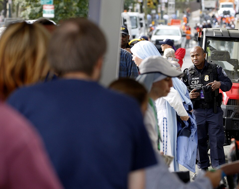 U.S. Customs and Border Protection (CBP) Officer Julio DeJesus (right) provides a law enforcement pr