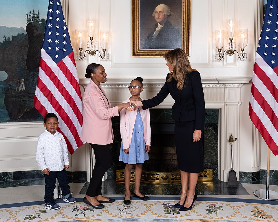 First Lady Melania Trump greets gallery guests fourth grader Janiyah Davis and her mother Stephanie 
