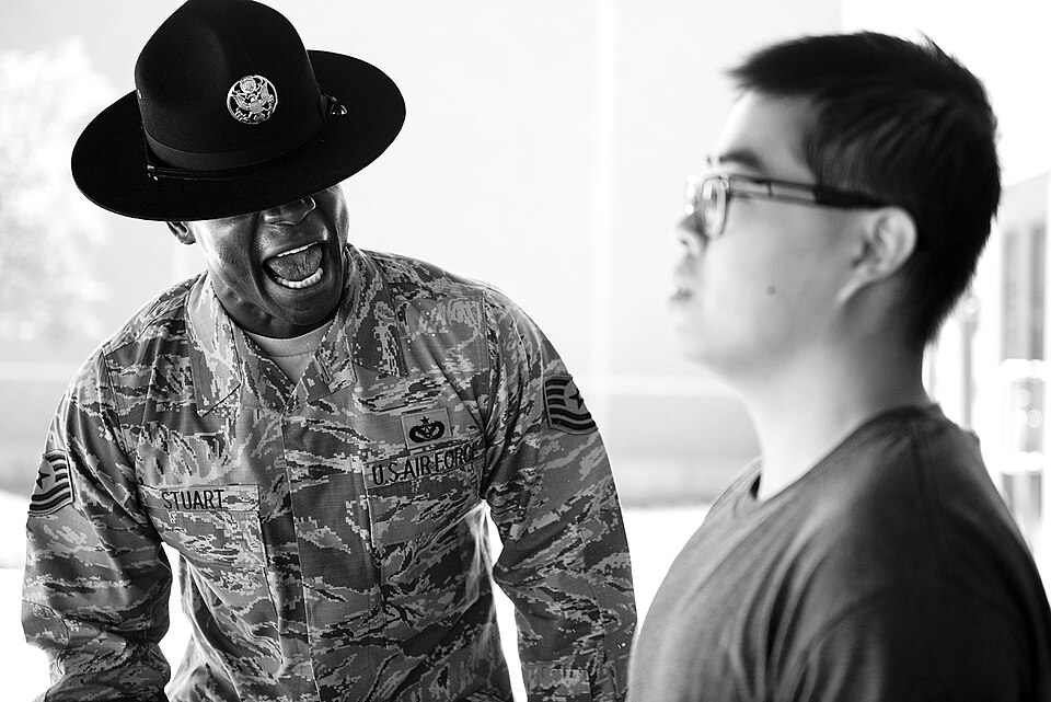 Tech. Sgt. Chananyah Stuart reminds a trainee of the procedures for entering the dining facility Sep