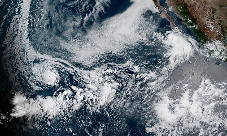 Two simultaneous active tropical cyclones in the Pacific Ocean on August 6, 2023, Hurricane Dora (le