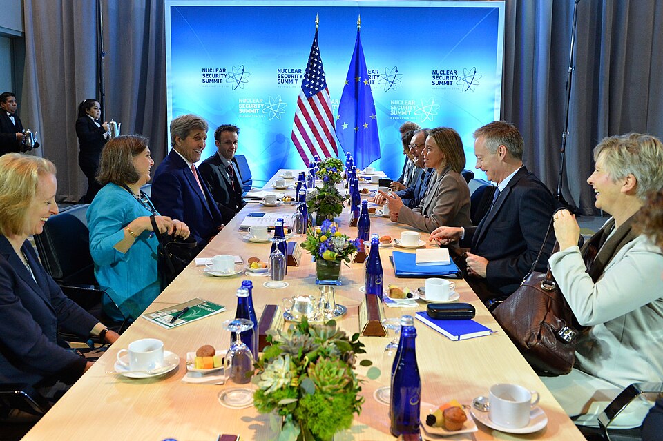 U.S. Secretary of State John Kerry -- flanked by Principal Deputy Assistant Secretary in the Bureau 