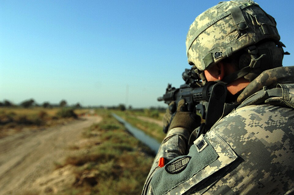A U.S. Soldier, assigned to 1-150th Company, Bravo Troop, 3rd Platoon, pulls security as vehicles ap