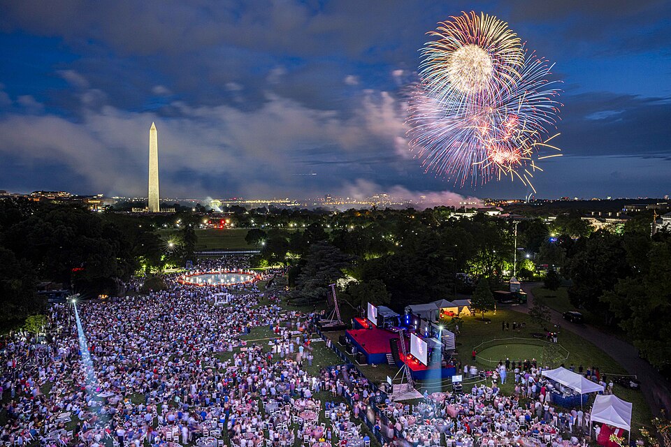 Guests view the fireworks display over the National Mall from the White House during Independence Da