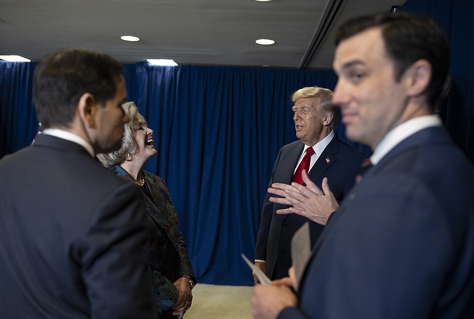President Donald Trump speaks to Chief of Staff Susie Wiles during the 80th session of the United Na